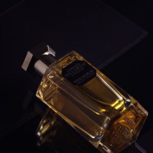 a bottle of perfume sitting on top of a table